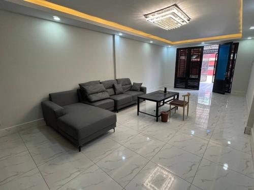 a living room with a couch and a table at Ashmita Shahi House in Kathmandu
