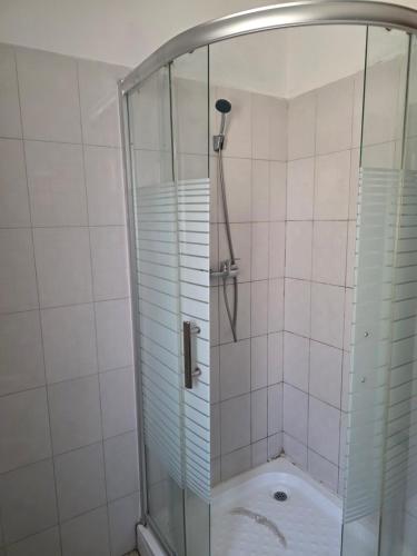 a shower with a glass enclosure in a bathroom at C7 double up in Camama