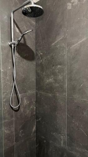 a shower in a bathroom with a glass door at Private big ROOM 20mins to Airport, 5mins to station in St Albans