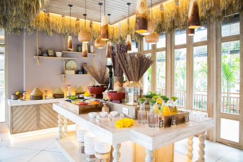 a kitchen with a table with drinks on it at The Series Resort Khaoyai in Phayayen