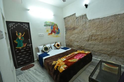 Ένα ή περισσότερα κρεβάτια σε δωμάτιο στο L G Guest House