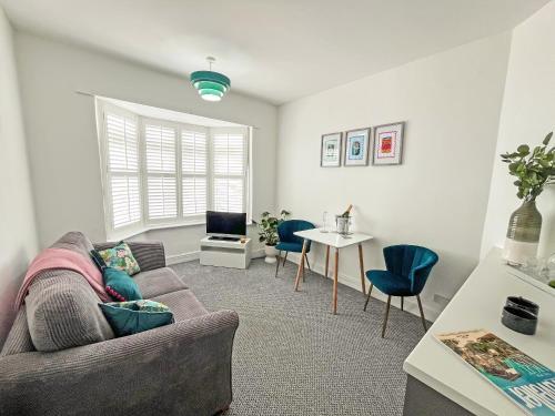 a living room with a couch and a table at Vine - Uk51860 in Ely
