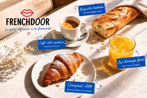 a breakfast table with a plate of croissants and a cup of coffee at Frenchdoor Orléans Cloître in Orléans