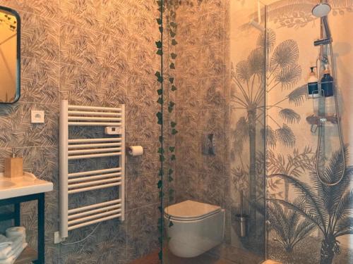 a bathroom with a shower and a toilet at Château de la Mothe in Olivet