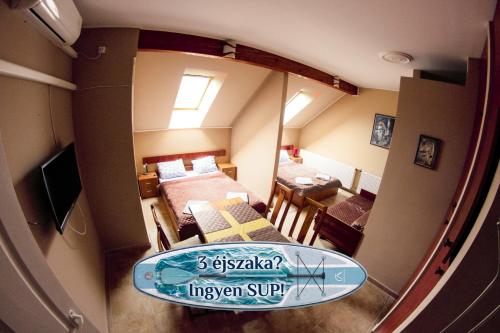 a view of a room with a surfboard on a table at Müller's 2 in Siófok