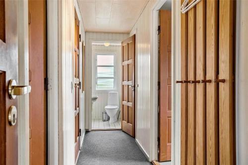 a hallway with a bathroom with a toilet in it at SJ243-Haderslev-Vikaerparken-79 in Haderslev