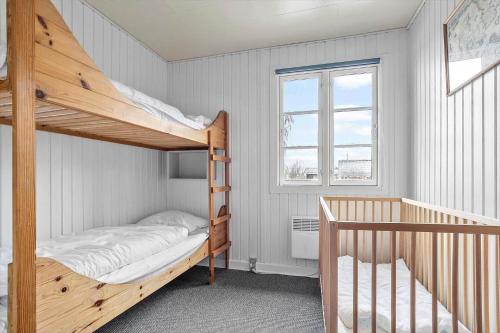 a bedroom with two bunk beds and a staircase at SJ243-Haderslev-Vikaerparken-79 in Haderslev