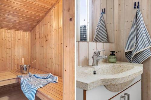 a bathroom with a sink in a wooden cabin at LN602-Hjorring-Harerenden-71 in Hjørring