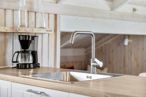 a kitchen sink with a mixer on a counter at LN1959-Hirtshals-Tangen-3 in Hirtshals