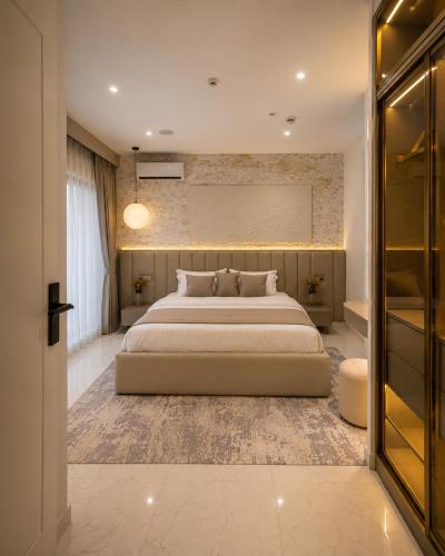 a bedroom with a large bed in a room at D'Empire in Lekki