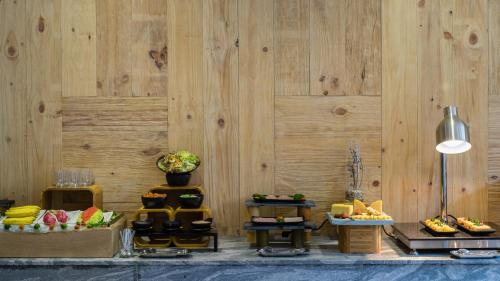 a table with a bunch of different types of food at Silverland Yen Hotel in Ho Chi Minh City