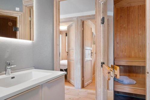 a bathroom with a sink and a room with a bedroom at SJ310-Hejls-Ronnebaervaenget-14 in Hejls