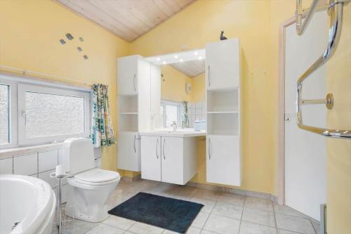 a bathroom with a toilet and a sink at LN1971-Lonstrup-Kirkedalsvej-7 in Lønstrup