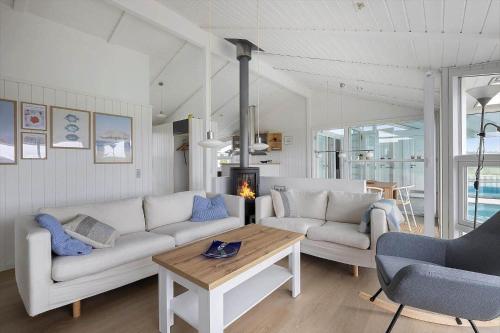a living room with two white couches and a table at LN1802-Hjorring-Bovlingbjergvej-4 in Hjørring