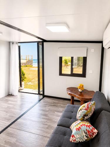 a living room with a couch and a view of the ocean at Oceanfront Villa, Punta Mango in Jucuarán