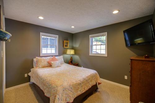a bedroom with a bed and a flat screen tv at Fire Pit & Floating Dock! Claytor Lake Hideout in Draper