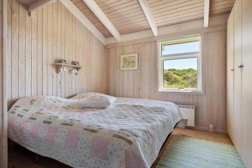 a bedroom with a bed in a room with a window at LN674-Hjorring-Rodspaettevej-16 in Hjørring