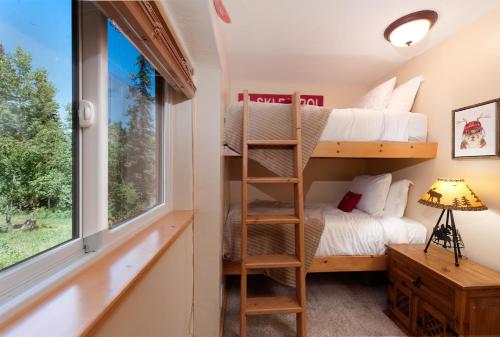 a bedroom with bunk beds in a tiny house at East Rim - Unit C12 in Durango