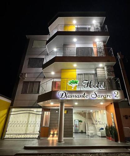 a building with a sign that reads hotel dynamic supreme at Hotel Diamante Sarare 2 in Saravena