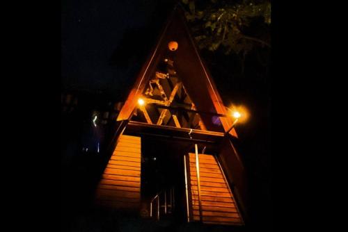 a house at night with two lights on it at Cottage Wild Boar in Udawalawe
