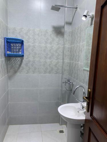 a bathroom with a shower and a sink at Voya Residence Dahab in Dahab