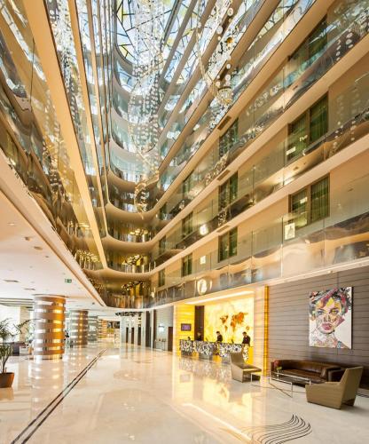 a large building with a large glass ceiling at Radisson Blu Hotel, Istanbul Sisli in Istanbul