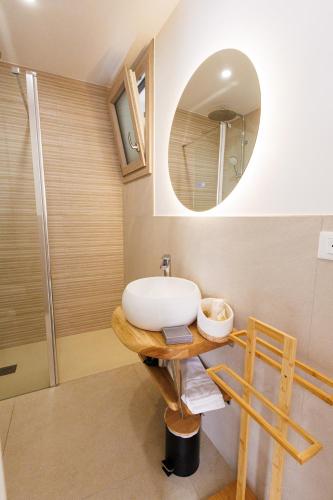 a bathroom with a sink and a mirror at Miria B&B in Castrignano del Capo