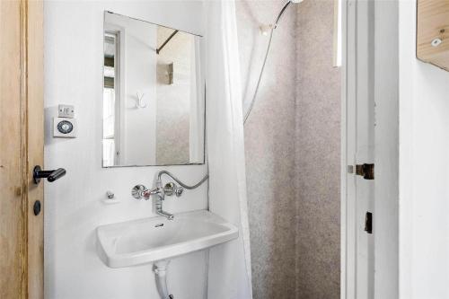 a bathroom with a sink and a mirror at LN76158-Hjorring-Bredningen-18 in Hjørring