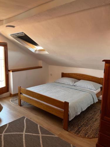 a bedroom with a bed and a ceiling at Studios Jacobus in Korčula