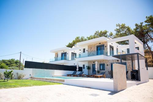 a villa with a view of the house at Villas Pasha in Faliraki