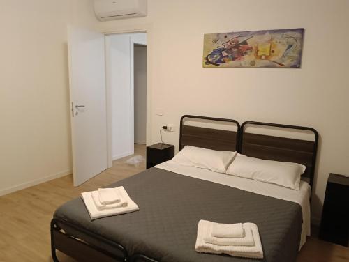 Llit o llits en una habitació de Hello Parma