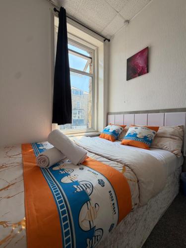 a bedroom with a bed and a window at Suncrest Hotel # Self-check-in in Blackpool