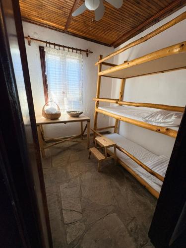 a room with two bunk beds and a window at Fisherman's Cove Epanomi in Epanomi