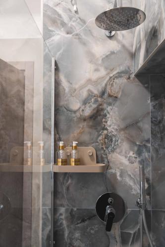 a bathroom with a shower with a glass door at 3Season Ortona B&B in Ortona