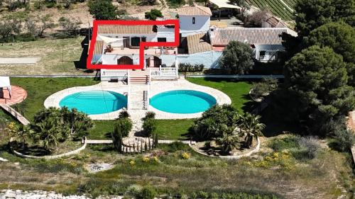 an aerial view of a house with a swimming pool at Guest Wing at Casa Africa in Lorca