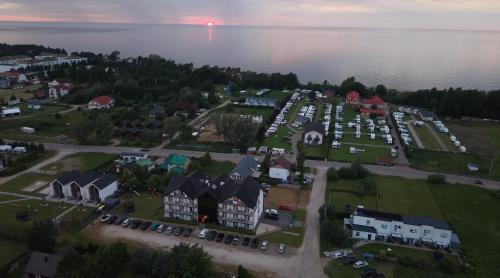 an aerial view of a town next to the water at Gęsi Puch in Gąski