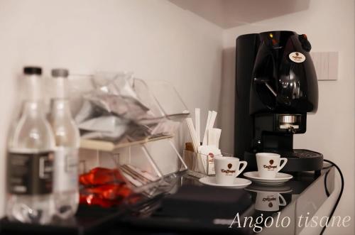 a kitchen with a coffee maker and cups on a counter at Relax in Puglia in Corato