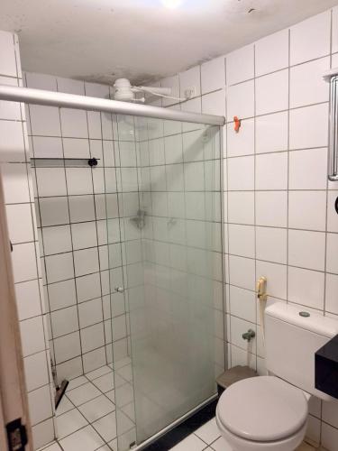 a bathroom with a glass shower with a toilet at Flat em Sao Jose da Coroa Grande in São José da Coroa Grande
