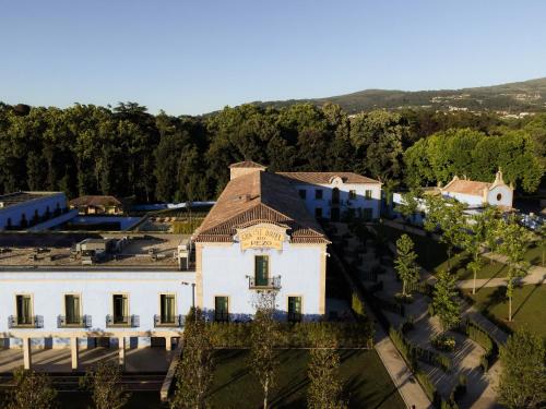 an aerial view of a white building with a brown roof at Oca Grande Hotel Do Pezo in Melgaço