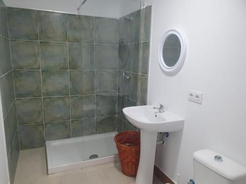 a bathroom with a sink and a shower at PUESTA DE SOL-Matalascañas in Matalascañas