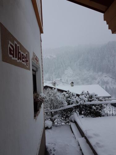 a view of a snow covered balcony of a building at Apartment Albert in Santa Cristina in Val Gardena
