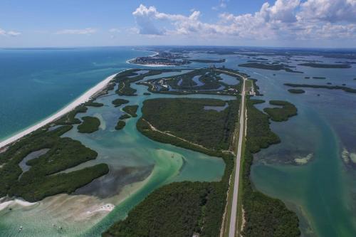 an aerial view of a group of islands in the water at Little EsCape in Matlacha