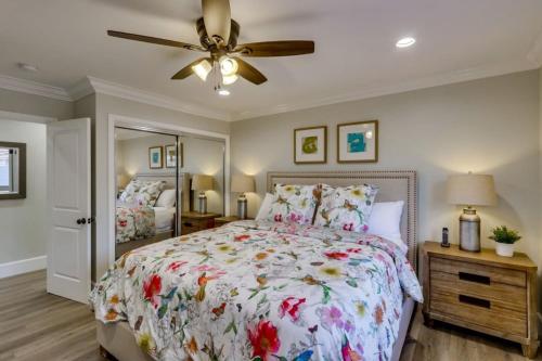 a bedroom with a bed and a ceiling fan at 5 Bedroom plus loft room, 3 Bath home in Fullerton