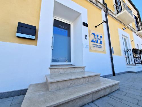 a building with a tv on the side of it at Al 211 Rooms in Pizzo