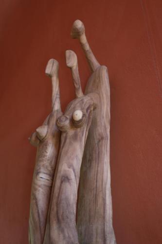 a statue of a person with their arms in the air at Nosy Lodge in Nosy Be
