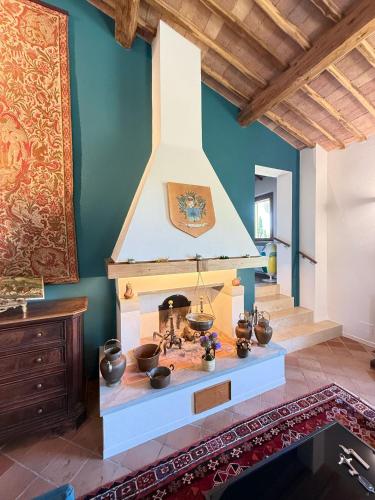 a living room with a fireplace in a house at Villa Santa Chiara in Siena