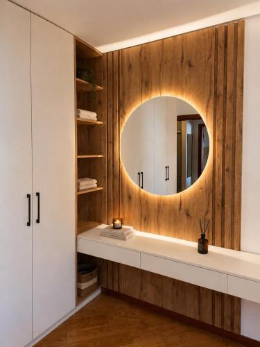 a bathroom with a sink and a mirror at Beachfront Pearl in Rafailovici