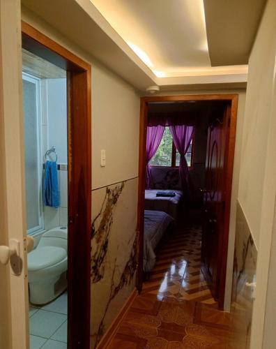 a bathroom with a wall that has been damaged at Casa de campo san Andrés in Otavalo