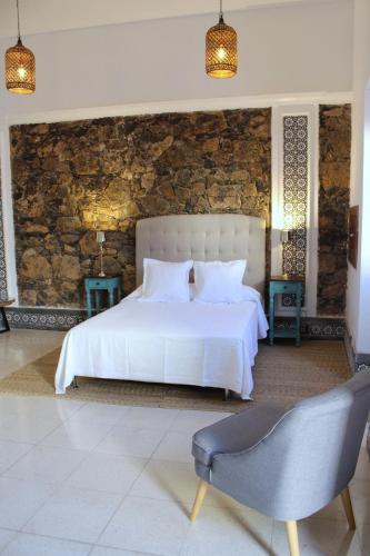 Postel nebo postele na pokoji v ubytování El Charco Suites