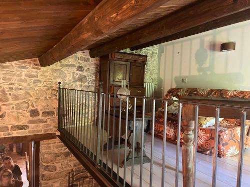 a dog sitting on a bed in a room at Il Convento di Roberta in Civitanova del Sannio
